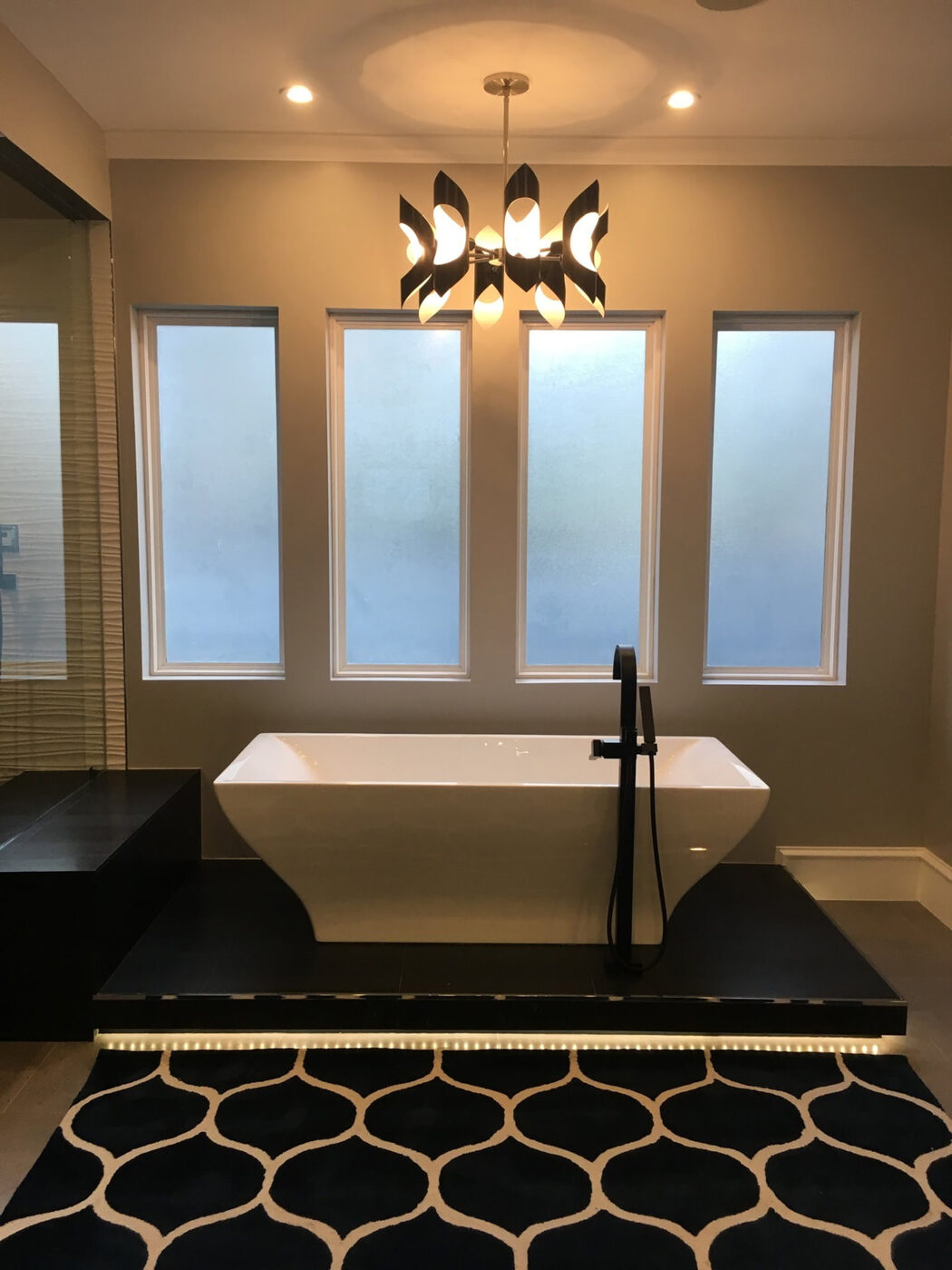 Master Bath with Freestanding Tub by Masterpiece Tile and Grout in the DFW area