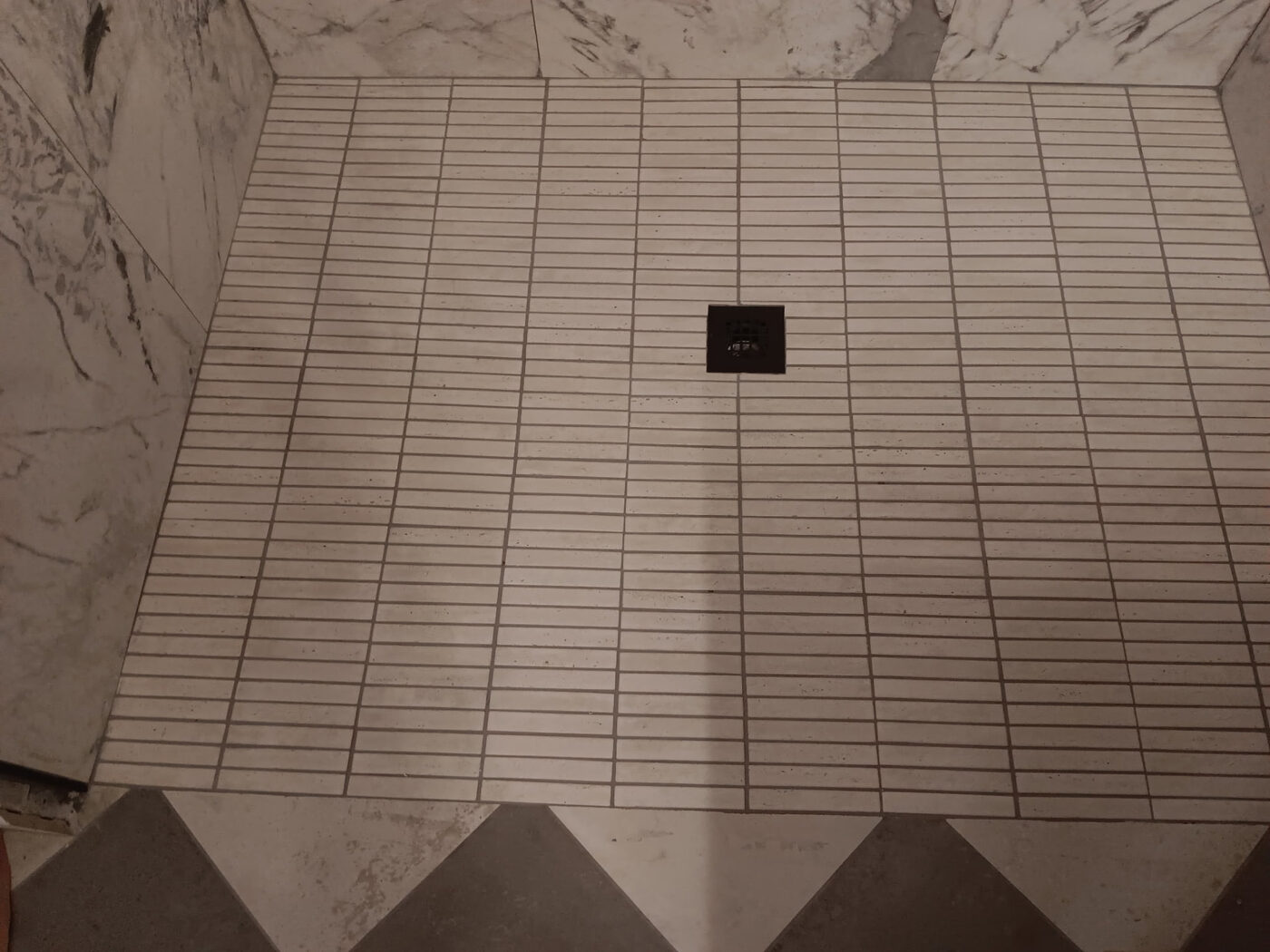 Shower Floor Tile Installation by Masterpiece Tile and Grout in the DFW area